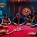 NOHU casino poker table shines with vibrant chips and intense players.