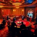 Experience the excitement of high-stakes gambling at https://luongsontv42.com/ with luxury poker tables and slot machines illuminated at night.