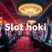 Exciting scene of players enjoying slot hoki machines in a vibrant casino.