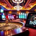 Engaging scene of luxury gambling with tv88 branding, featuring roulette and poker elements.