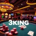 3KING poker table featuring vibrant chips and cards surrounded by excited players in a luxurious casino setting.